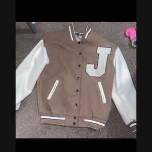 Fashion nova varsity jacket. New !!